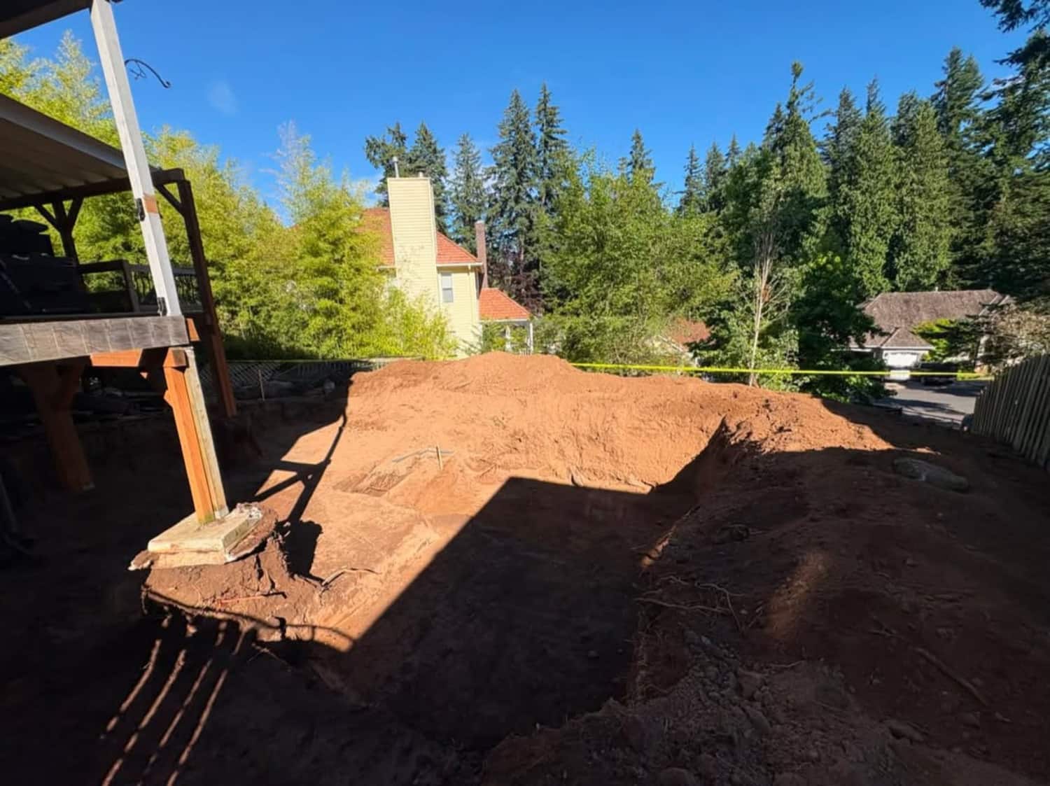 Utility trench excavation, bedding, and compacted backfill.