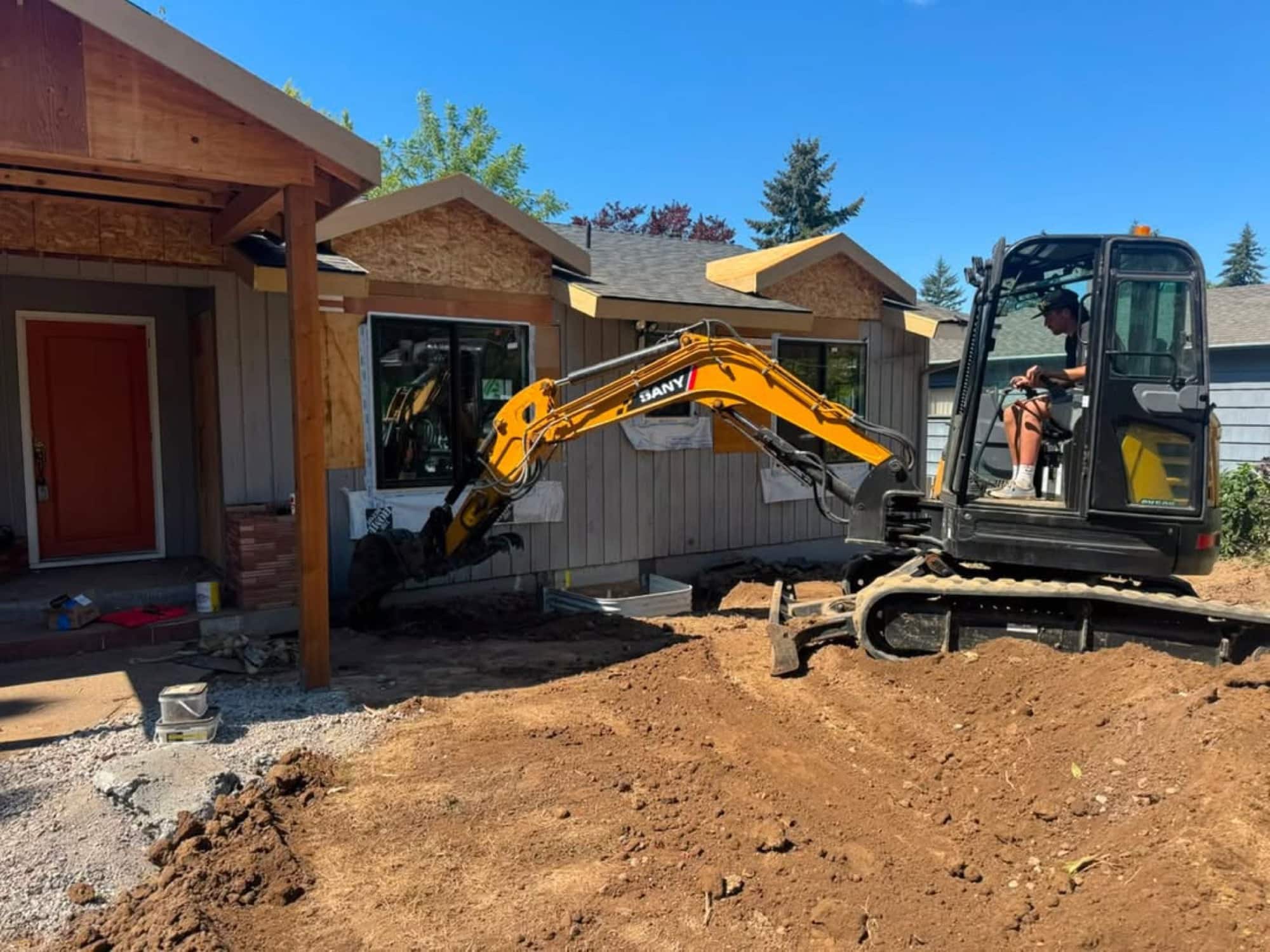 A&N excavator working on a residential site in the Portland metro area